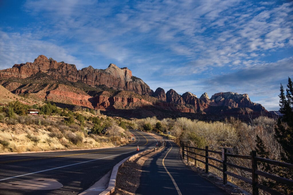 The Zion Half Marathon course along a paved road with mountains against the sky