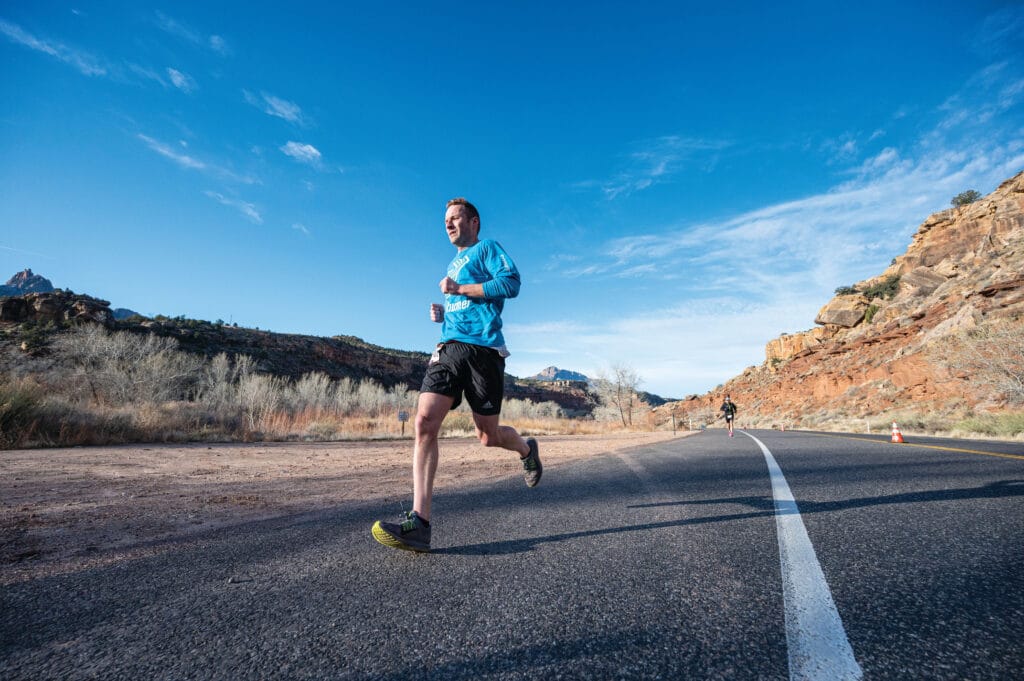 A man running on paved road