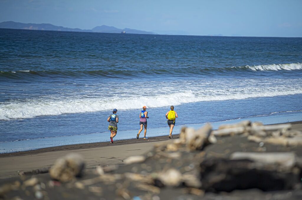 three runners on the beach in Jaco