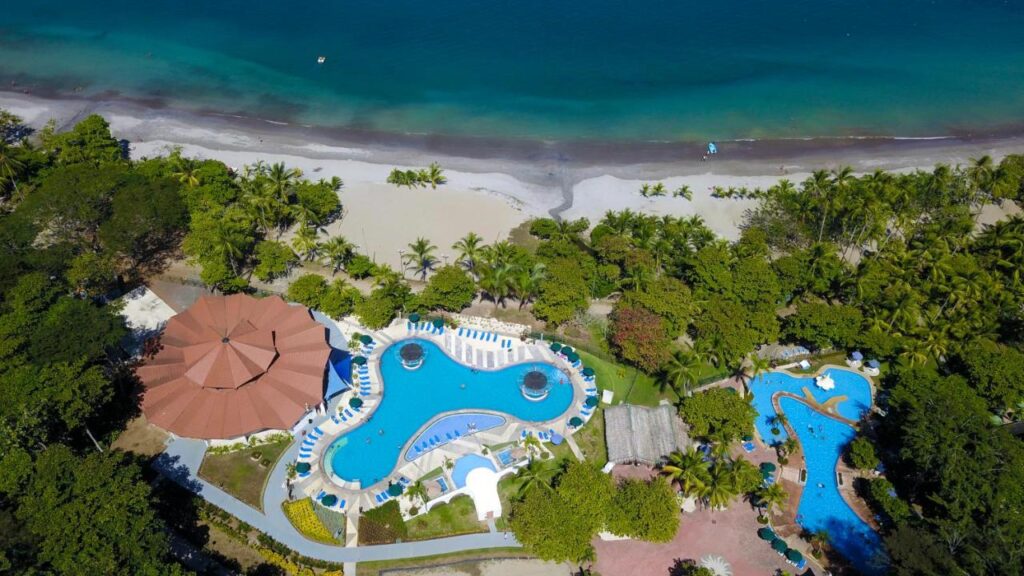 Aerial shot of Punta Leona hotel pool and beachfront