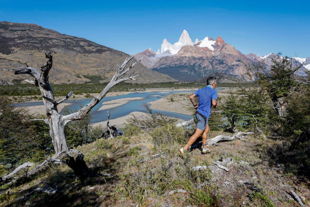 person running with mount fitz roy ahead of them