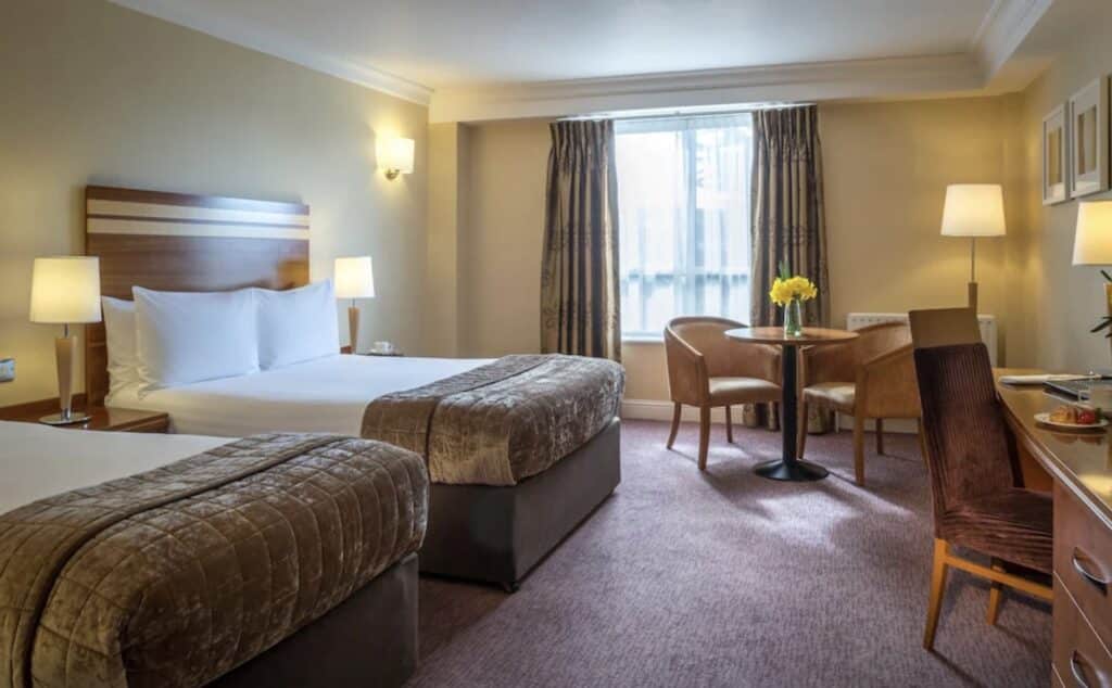 stately hotel room with cushioned blankets