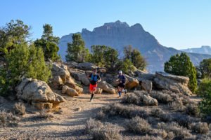 Two runners approach as the complete the Wire Mesa section of the Zion trail at Kanab Trailfest