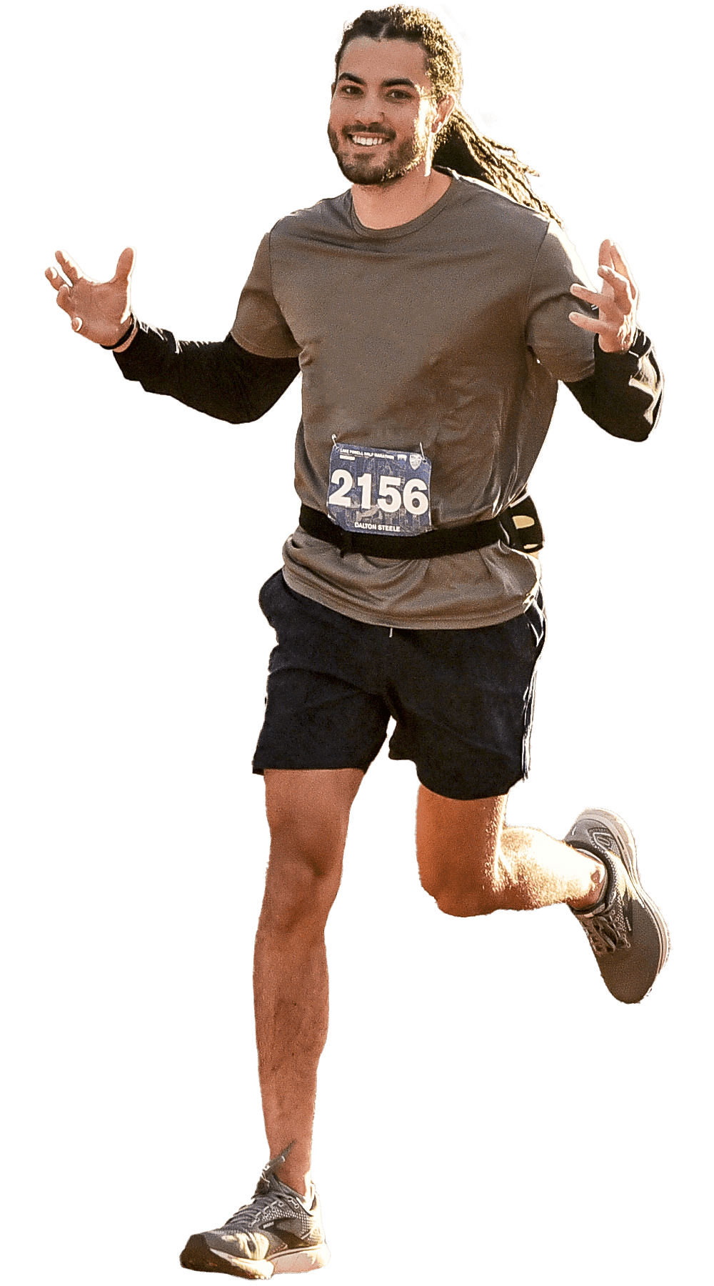 Lake Powell 2021-98-2 Man with dreadlocks smiling as he runs towards the camera