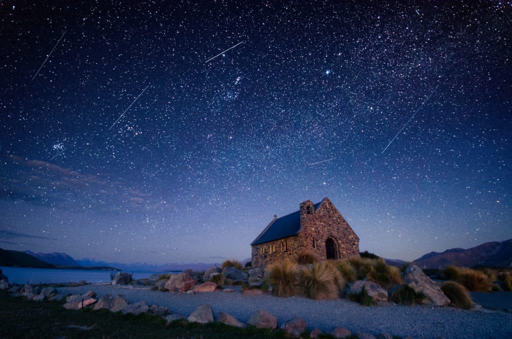 Lake Tekapo's Dark Sky is featured here as glowing stars move across a night sky