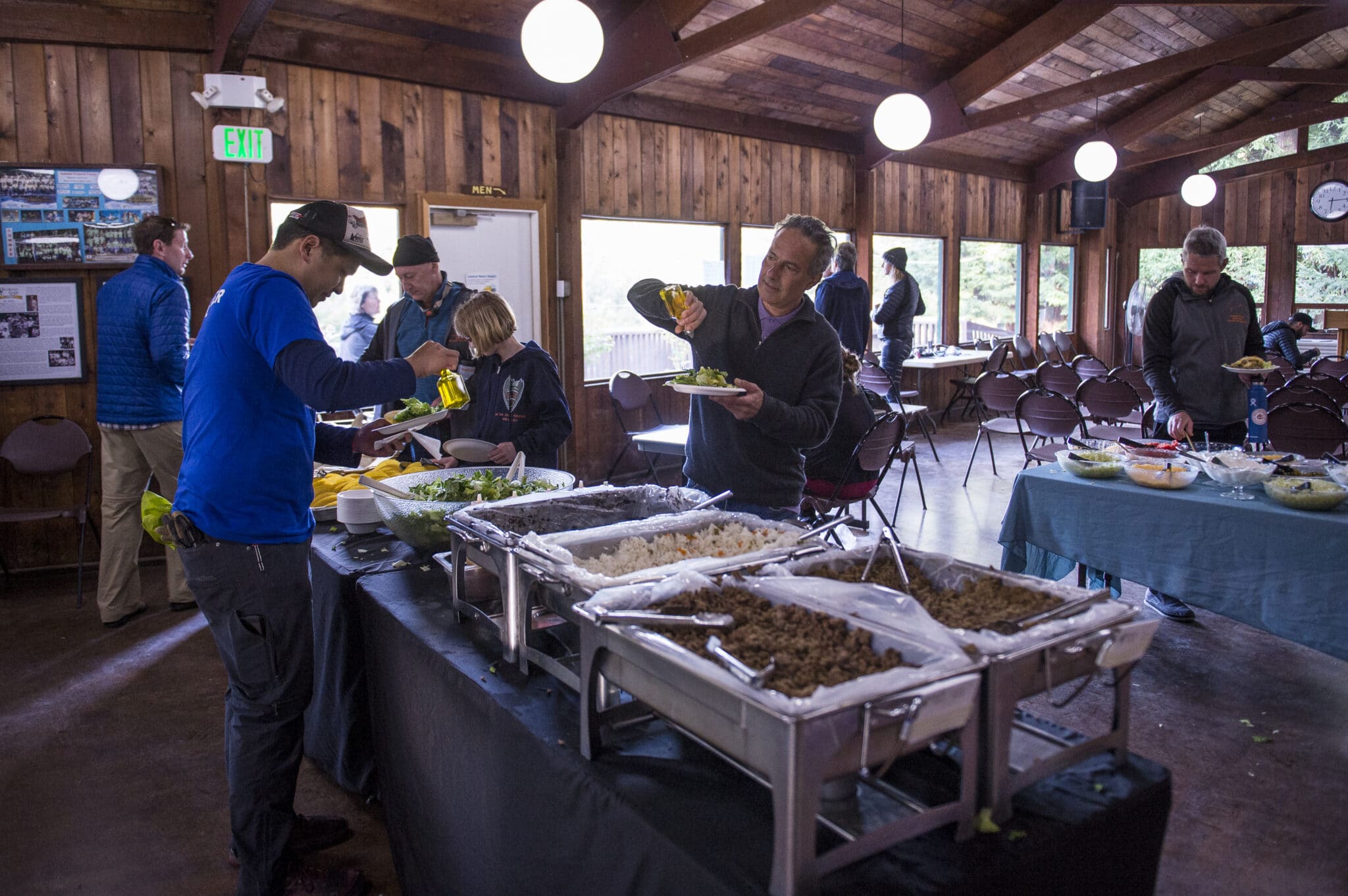 Vacation Races runners refuel at the mess cabin with a warm meal after a Coastal Redwoods Trailfest race