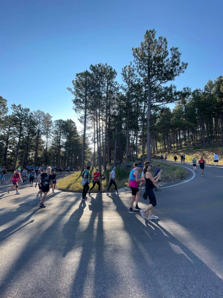 Runners turning the corner at the Mount Rushmore Half Marathon in the Black Hills