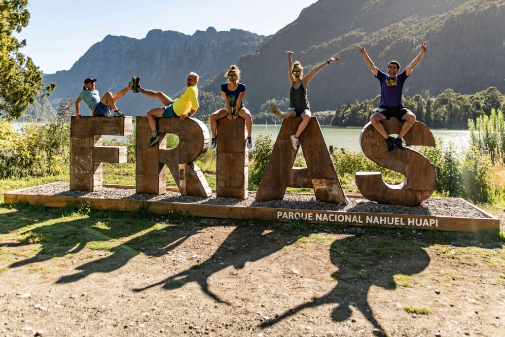 Global Adventures runners pose on the border of Chile and Argentina during their running travel