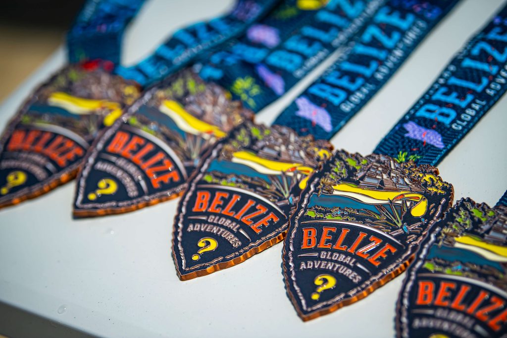 Belize Global Adventure medals lay out waiting for runners to cross the finish line