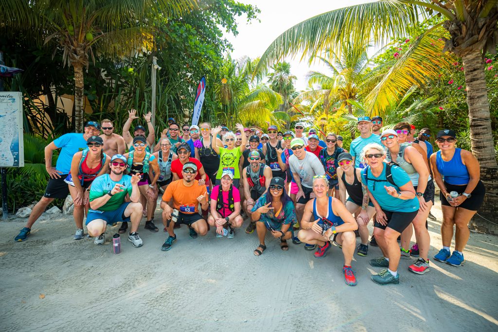 Global Adventures Belize runners pose at the start line of their all-inclusive running trip