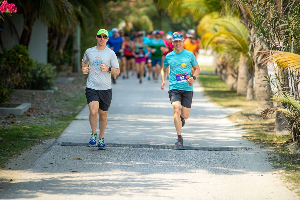 Two men lead the pack on an early Belize morning on Ambergris Caye at the all-inclusive running trip