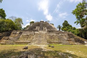 Run, jump, and marvel at the Lamanai Mayan Archaeological Ruins during the Vacation Races all-inclusive Belize Global Adventure running trip