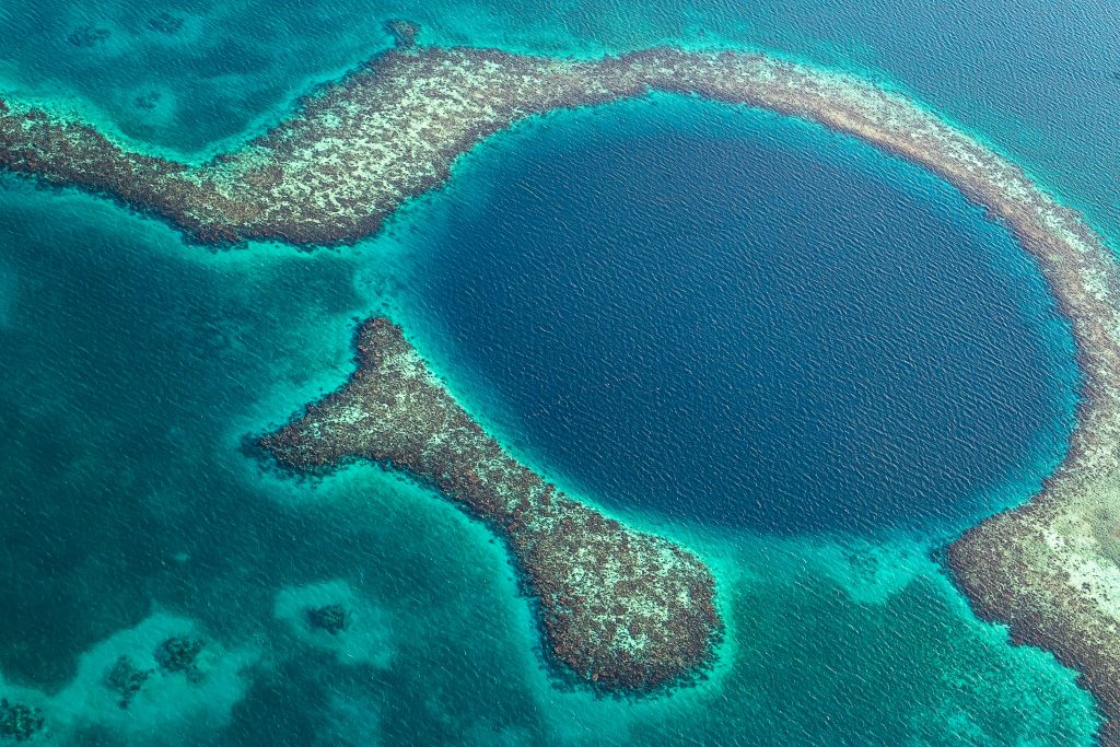 An aerial shot of Blue Hole in Belize