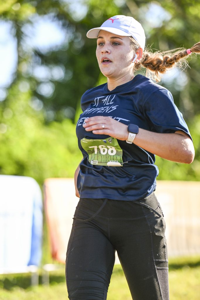 A determined Vacation races runner flies towards the finish line at the Everglades half marathon