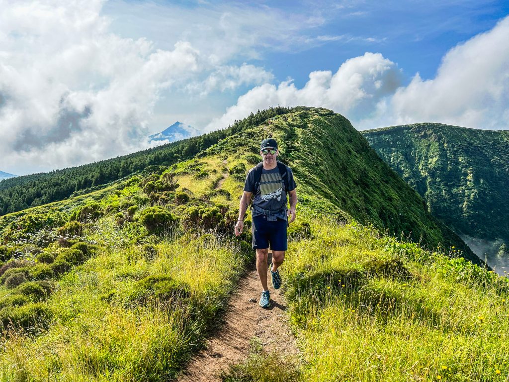 Vacation Races runners enjoy the sun as they run through lush, green volcanic trails on their all-inclusive running trip to Portugal's Azores