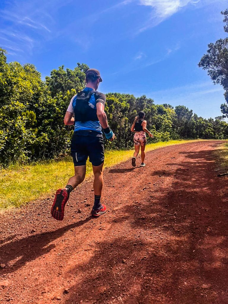 Vacation Races runners enjoy the sun as they run through lush, green volcanic trails on their all-inclusive running trip to Portugal's Azores