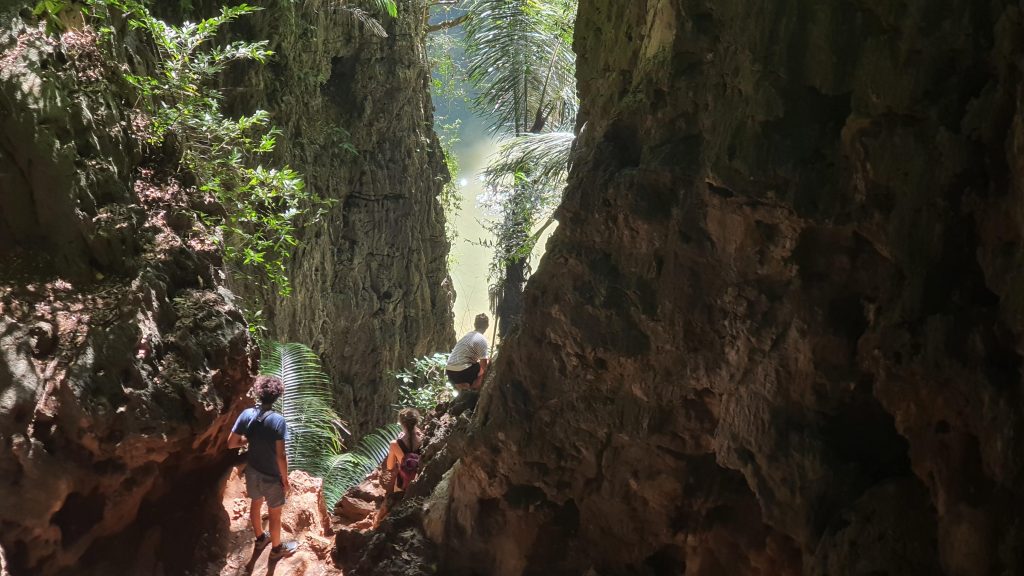 Vacation Races runners climb down to a hidden tropical beach in Krabi
