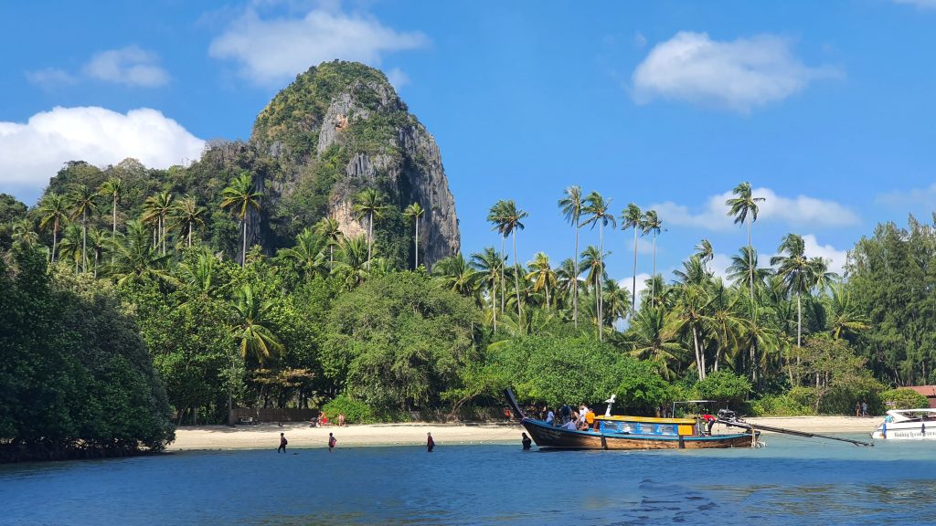 A picturesque beach scene with towering rock formations near Krabi Thailand